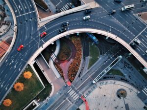 Aerial view of highways with cars travelling along. 